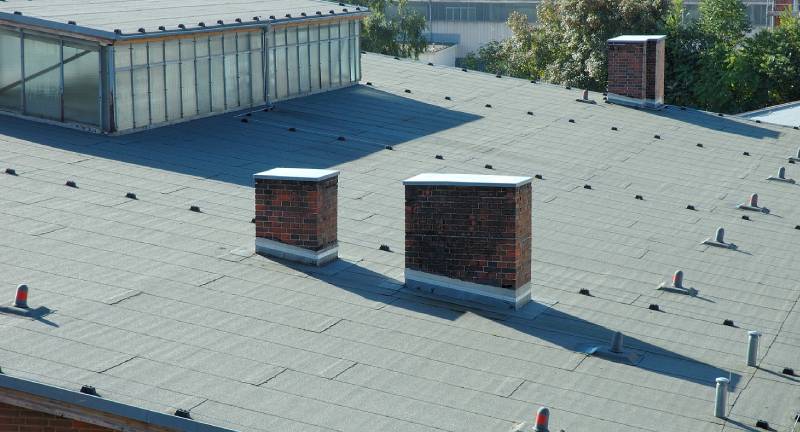 A view of two chimneys on the roof.
